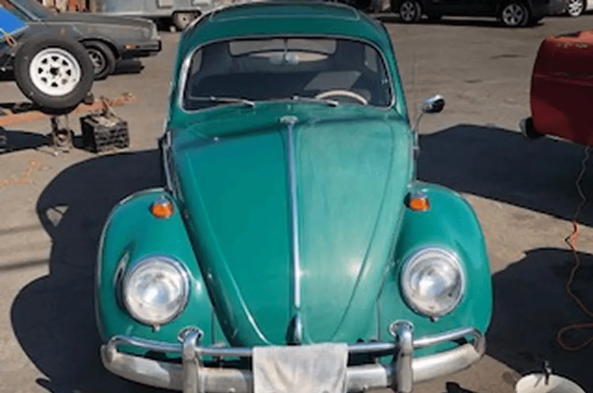 Retro green Beetle parked outdoors
