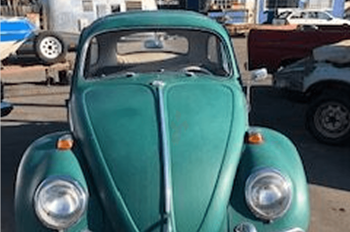 Classic Beetle parked in a lot