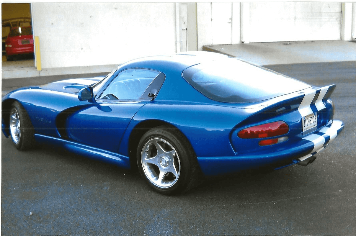 Sleek blue coupe with silver wheels