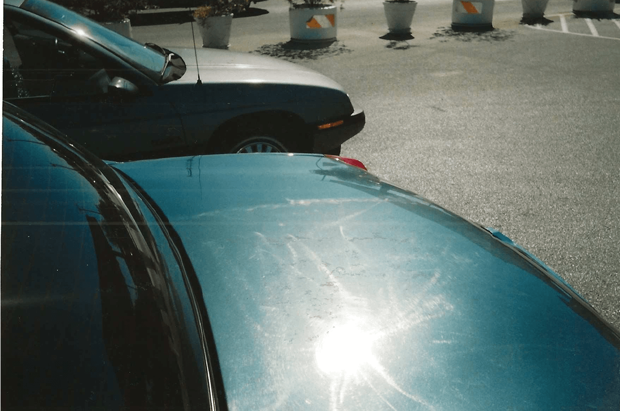 Parked cars in a sunny lot