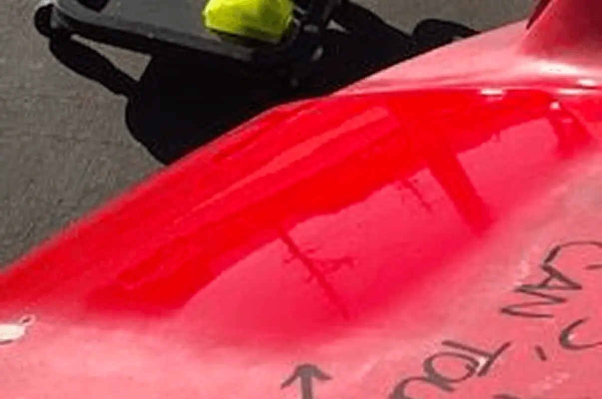 Toolbox on wheels near red object