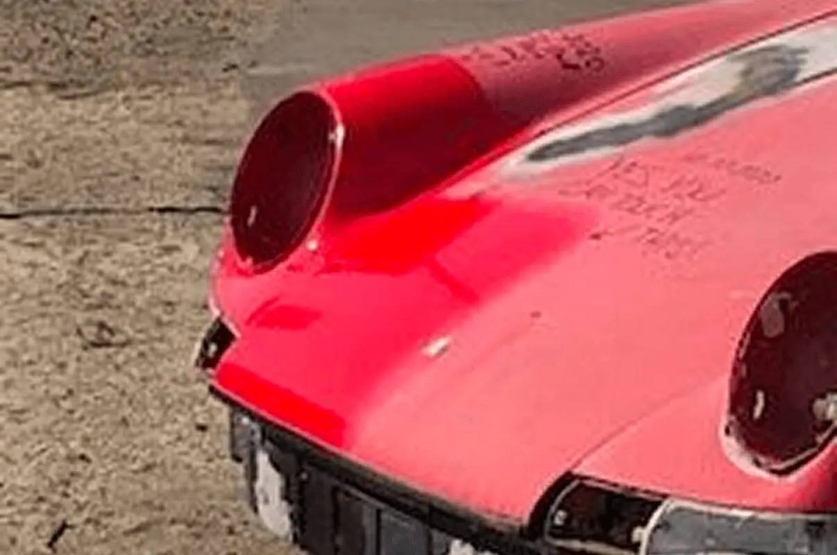 Classic car missing headlights on street