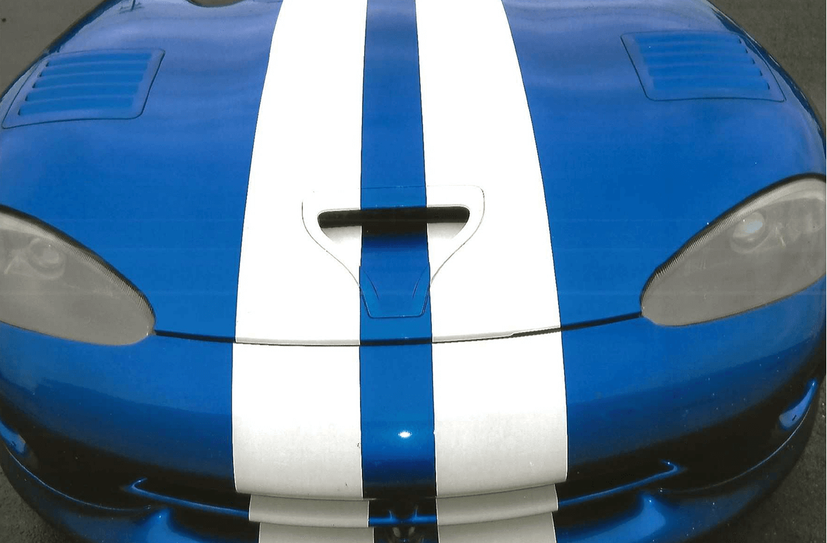 Blue sports car with white racing stripes on the hood.